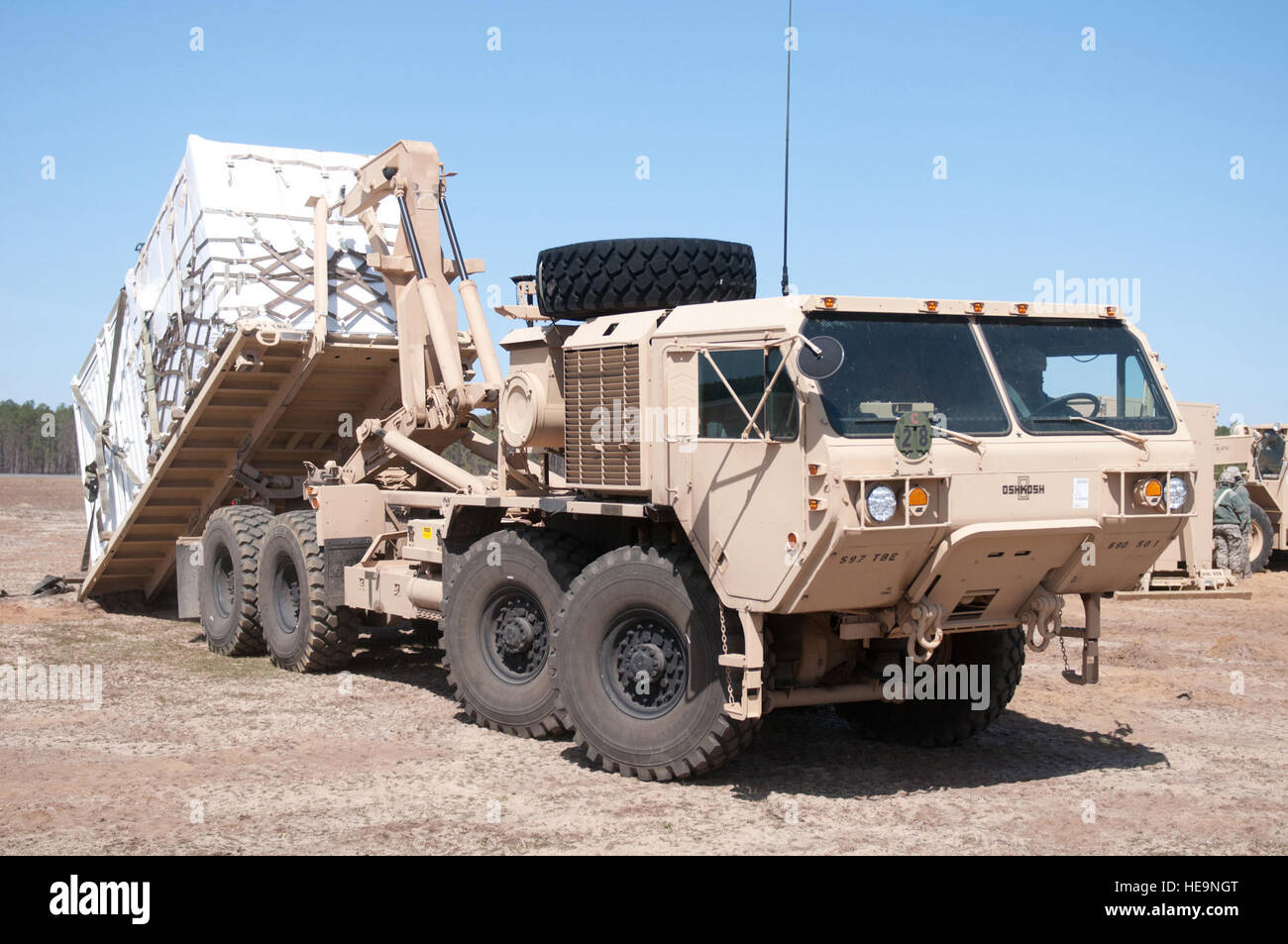 A U.S. Army soldier from the 690th Rapid Port Opening Element loads a ...