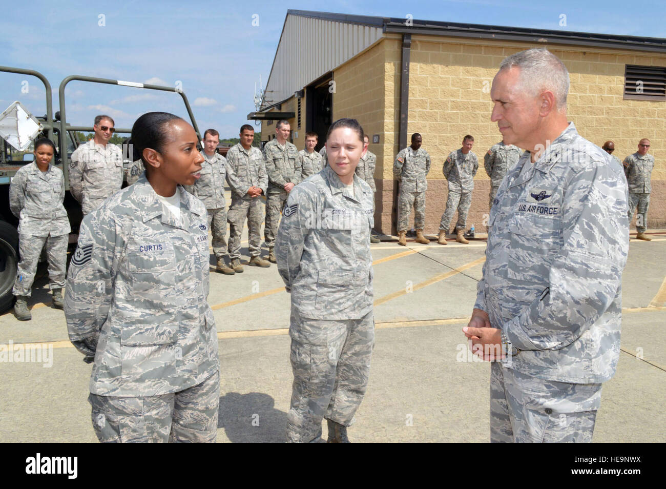 Maj. Gen. Rick Martin, U.S. Air Force Expeditionary Center commander, receives a mission briefing from Tech. Sgt. Shaffiyah Curtis, 3d Aerial Port Squadron, during his tour of 43d Airlift Group units Sept 16. Gen. Martin visited Pope Army Airfield, N.C., to see first-hand how the 43d Airlift Group Airmen support the Global Response Force mission. (U.S. Air Force Photo/Marvin Krause) Stock Photo