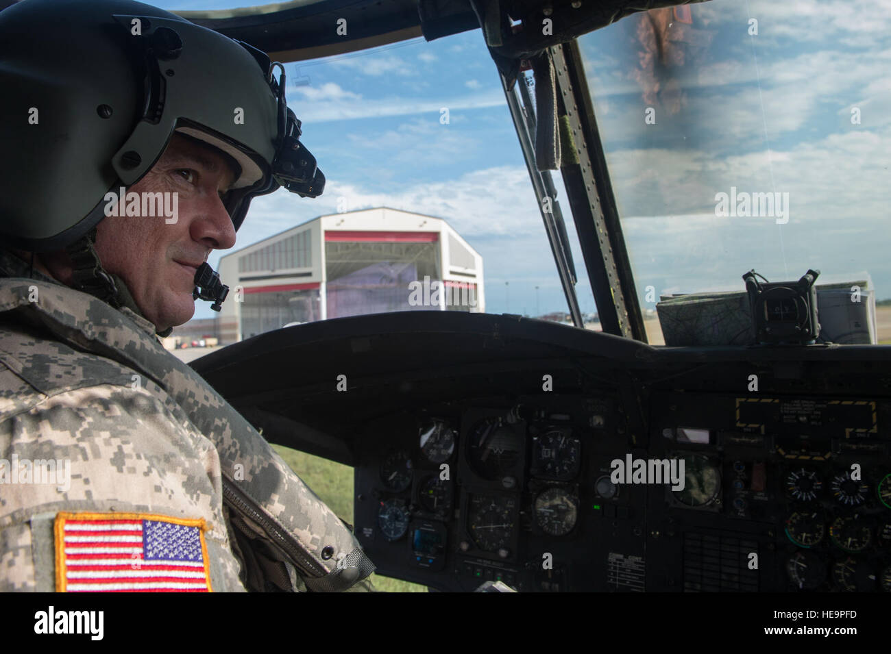 A U.S. Army member of Bravo Company, 1-111th Aviation Battalion, completes pre-flight checks of a CH-47 Chinook during Emerald Warrior 2015, Gulfport Combat Readiness Training Center, Miss., April 23, 2015. Two CH-47s were tasked to support a U.S. Navy Seal team helocasting mission by transporting personnel to and from the drop zone. Emerald Warrior is the Department of Defense's only irregular warfare exercise, allowing joint and combined partners to train together and prepare for real world contingency operations.  Staff Sgt. DeAndre Curtiss Stock Photo