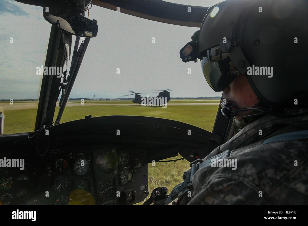 A U.S. Army member of Bravo Company, 1-111th Aviation Battalion, completes the pre-flight checks of a CH-47 Chinook during Emerald Warrior 2015, Gulfport Combat Readiness Training Center, Miss., April 23, 2015. Two CH-47s were tasked to support a U.S. Navy Seal team helocasting mission by transporting personnel to and from the drop zone. Emerald Warrior is the Department of Defense's only irregular warfare exercise, allowing joint and combined partners to train together and prepare for real world contingency operations.  Staff Sgt. DeAndre Curtiss Stock Photo