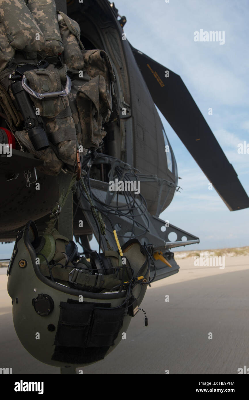 A helmet belonging to a member of Bravo Company, 1-111th Aviation Battalion, hangs from a CH-47 Chinook during Emerald Warrior 2015, Eglin Air Force Base, Fla., April 23, 2015. Two CH-47s were tasked to support a U.S. Navy Seal team helocasting mission by transporting personnel to and from the drop zone. Emerald Warrior is the Department of Defense's only irregular warfare exercise, allowing joint and combined partners to train together and prepare for real world contingency operations.  Staff Sgt. DeAndre Curtiss Stock Photo