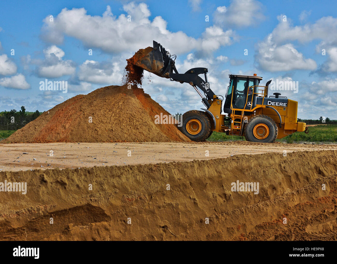 Eglin range services haul dirt away from a target to prepare a path for