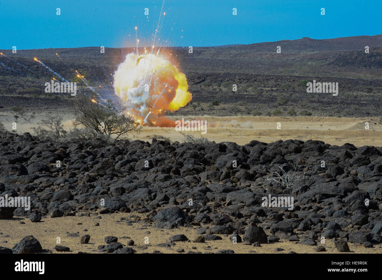 U.S. Navy Explosive Ordnance Disposal members detonate 200 pounds of ordnance in Grand Bara, Djibouti, Dec. 10, 2014. Navy EOD ensures the demolition of various types of explosives and hazardous munitions.  Senior Airman Colville McFee Stock Photo