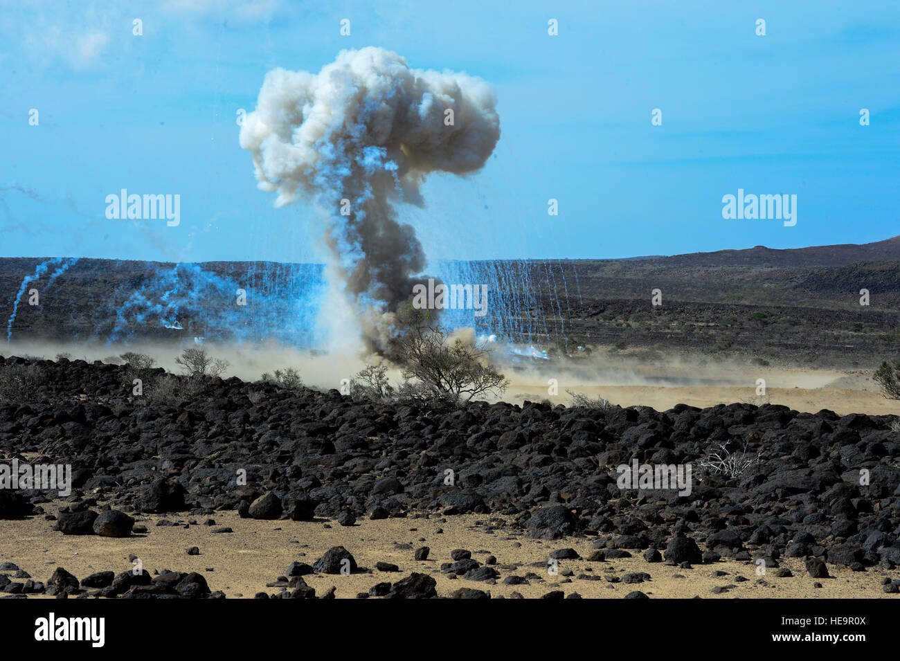 U.S. Navy Explosive Ordnance Disposal members detonate 200 pounds of ordnance in Grand Bara, Djibouti, Dec. 10, 2014. Navy EOD conduct demolition of hazardous munitions, pyrotechnics, and retrograde explosive using detonation and burning techniques.  Senior Airman Colville McFee Stock Photo