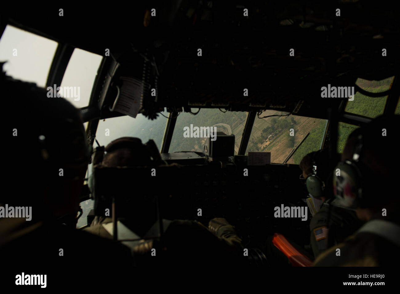 U.S. and Thai Air Forces conduct static and High Altitude Low Opening jumps from a U.S. C-130 during Exercise Cope Tiger 15 near Udon, Thailand, March 11, 2015. CT15 includes 22 total flying units and over 1,390 personnel from three countries and continues the growth of strong, interoperable, and beneficial relationships within the Asia-Pacific region through integration of airborne and land-based command and control assets.  Airman 1st Class Taylor Queen Stock Photo