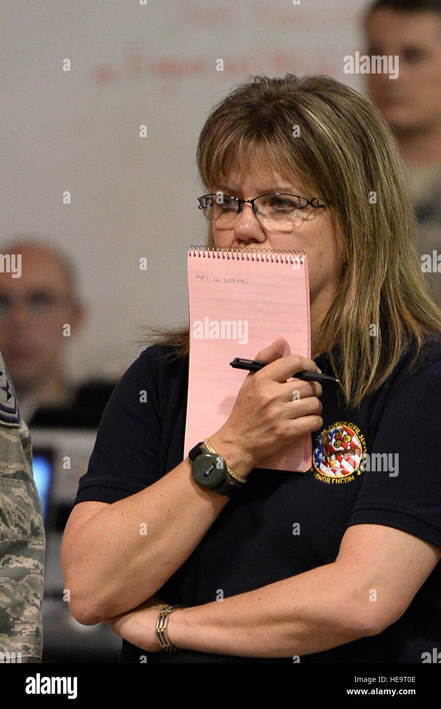 Members of Joint Task Force Civil Support listen to the shift change ...