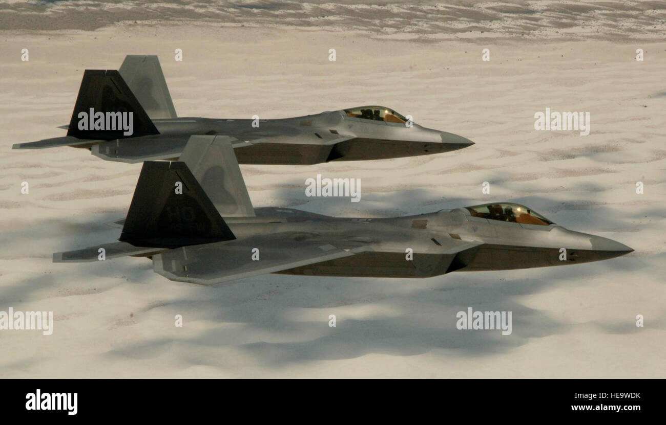 Two U.S. Air Force F-22 Raptors fly over White Sands National Monument ...