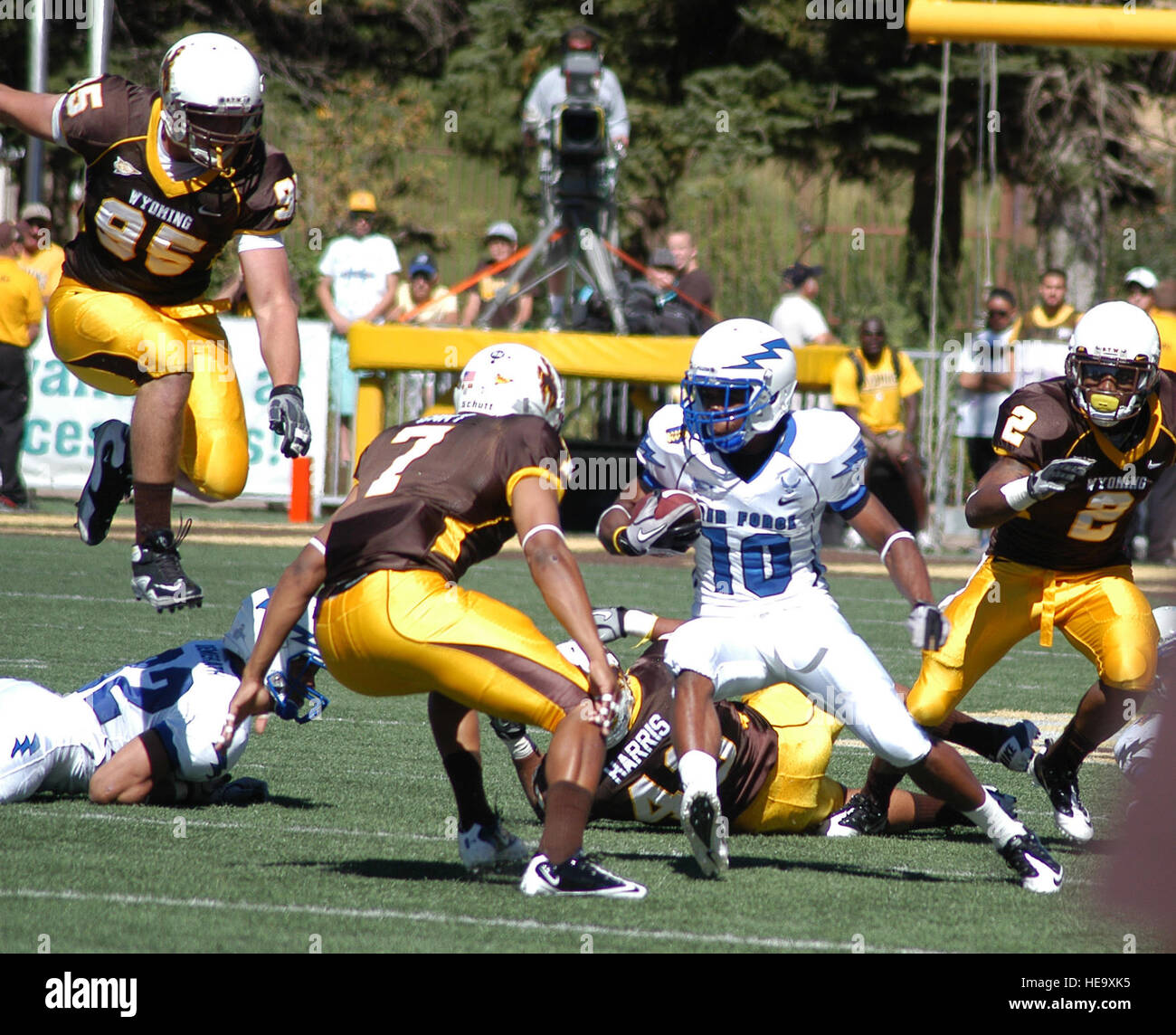 Air Force receiver Mikel Hunter tries to elude Wyoming safety Shamiel Gary during the Falcons-Cowboys game in Laramie, Wyo., Sept. 25, 2010. Air Force came from seven points behind in the third quarter, scoring two unanswered touchdowns to win 20-13. Hunter is a sophomore and native of Conyers, Ga. John Van Winkle) Stock Photo
