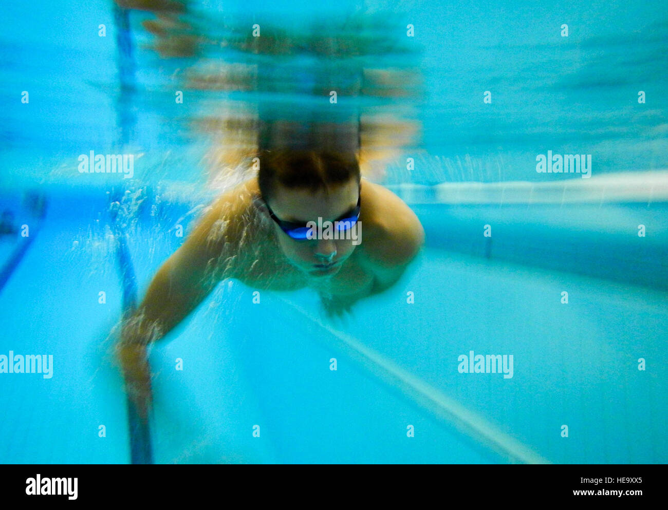 A swimmer from the Lakenheath Barracudas swim team performs swimming techniques during practice at Royal Air Force Honington, England, Sept. 4, 2014. The European Forces Swim League is comprised of American and British swimmers who attend weekly practices and compete against other EFSL teams around the European region.  Airman 1st Class Erin O’Shea Stock Photo