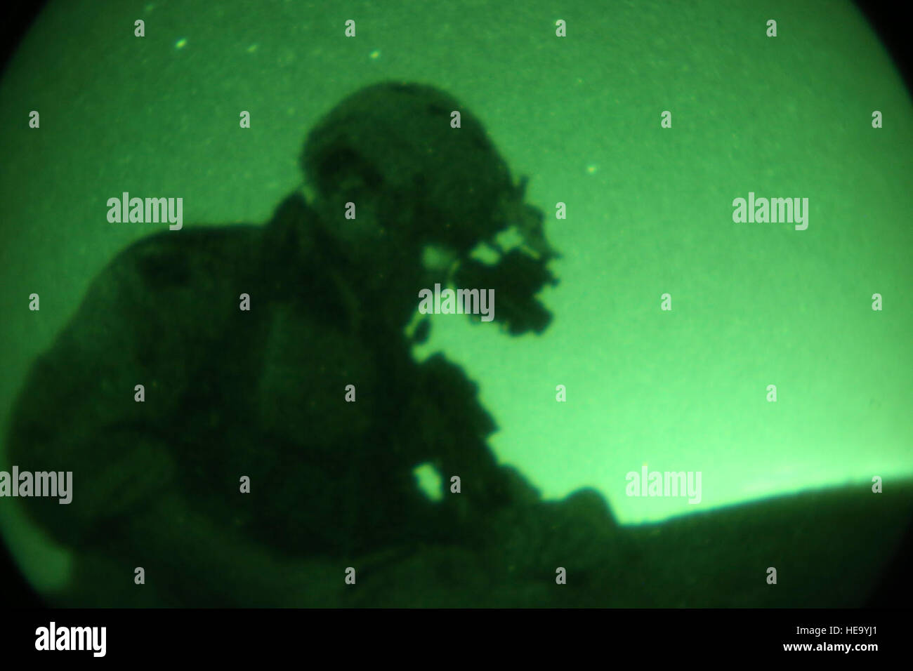 A Marine with Company B, 1st Reconnaissance Battalion, 1st Marine Division, adjusts his gear during a night reconnaissance mission aboard Camp Pendleton, Calif., Sept. 28, 2016. During a recon mission, Marines spend their time monitoring enemy actions and reporting them to higher headquarters. Commanders use the information to plan raids that can capture high value targets.  Lance Cpl. Joseph Prado) Stock Photo