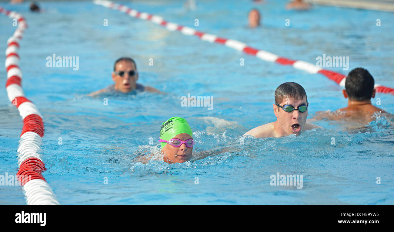 Members of Team Whiteman participate in the 420-meter swim portion of a triathlon at Whiteman Air Force Base, Mo., June 21, 2013. Other events in the triathlon included a 10-kilometer bicycle race and a five-kilometer run.  Staff Sgt. Nick Wilson Stock Photo