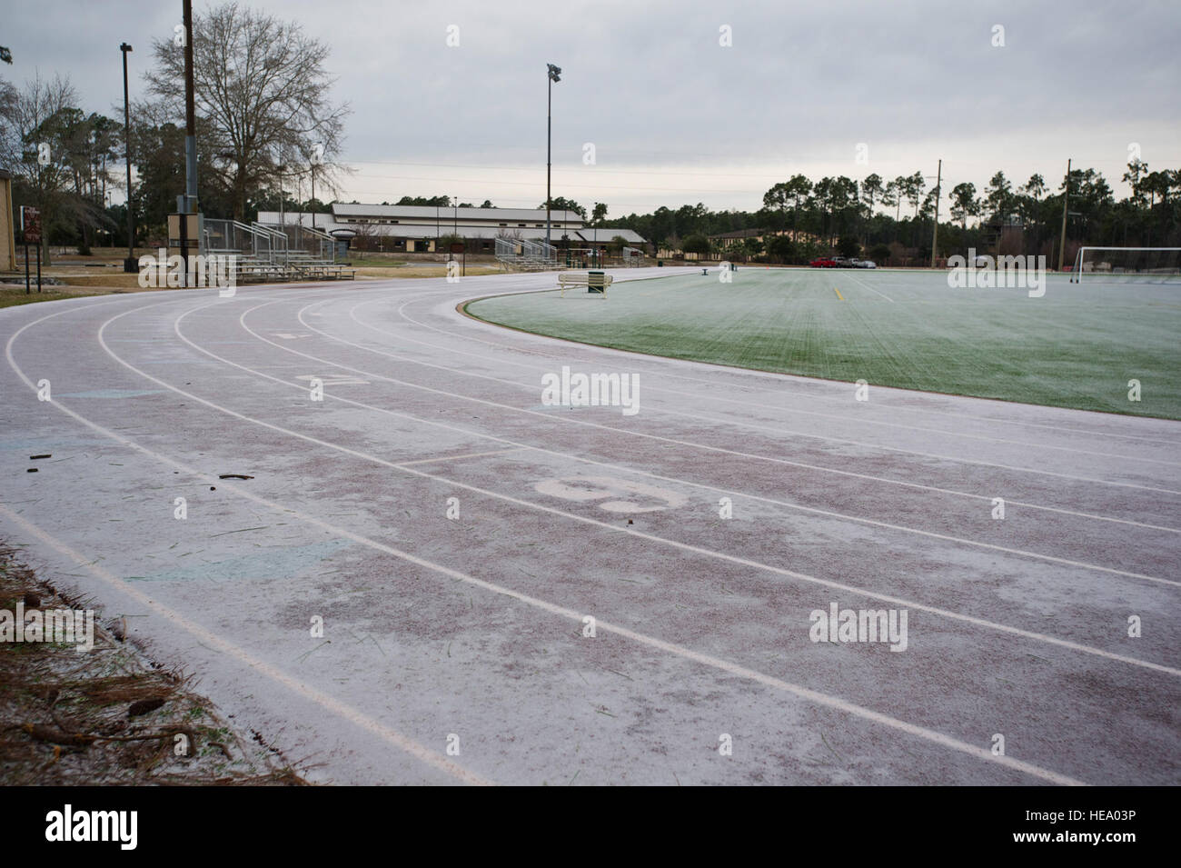 Frost and ice cover the track and field at the Aderholt Fitness Center at Hurlburt Field, Fla., Jan. 29, 2014. A winter storm accompanied by freezing rain left the majority of the base covered in a thin sheet of ice.( U.S. Air Force Photo/ Staff Sgt. John Bainter) Stock Photo
