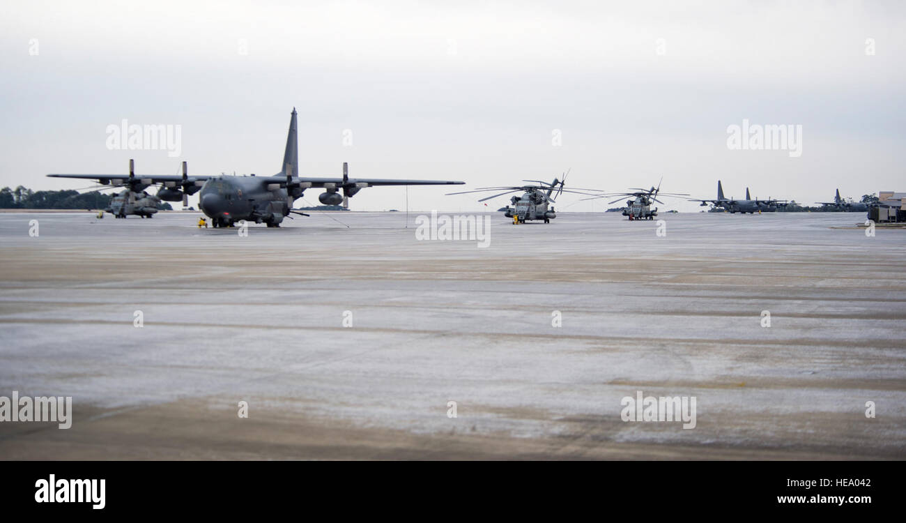 Aircraft remain secured to the flightline at Hurlburt Field, Fla., Jan. 29, 2014. High winds and freezing rain, brought by a winter storm coated aircraft and the flightline in a layer of ice. (U.S. Air Force Photo/ Staff Sgt. John Bainter) Stock Photo