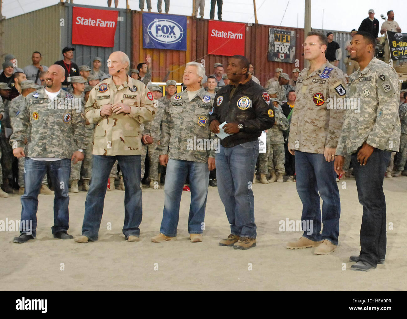 BAGRAM AIR FIELD, Afghanistan -- (From left to right) Jay Glazer, Terry Bradshaw, Jimmy Johnson, Curt Menefee, Howie Long, and Michael Strahan, the “Fox NFL Sunday” team, wait for the start of the pregame Nov. 7, 2009.  The “Fox NFL Sunday” team is scheduled to broadcast live Nov. 8, 2009 from here.  Senior Airman Felicia Juenke) Stock Photo