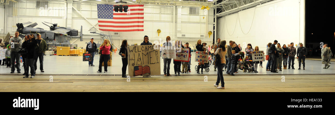 Friends and family members of U.S. Airmen returning from a deployment wait in the Freedom Hangar at Hurlburt Field, Fla., Jan. 12, 2014.  Staff Sgt. John Bainter Stock Photo