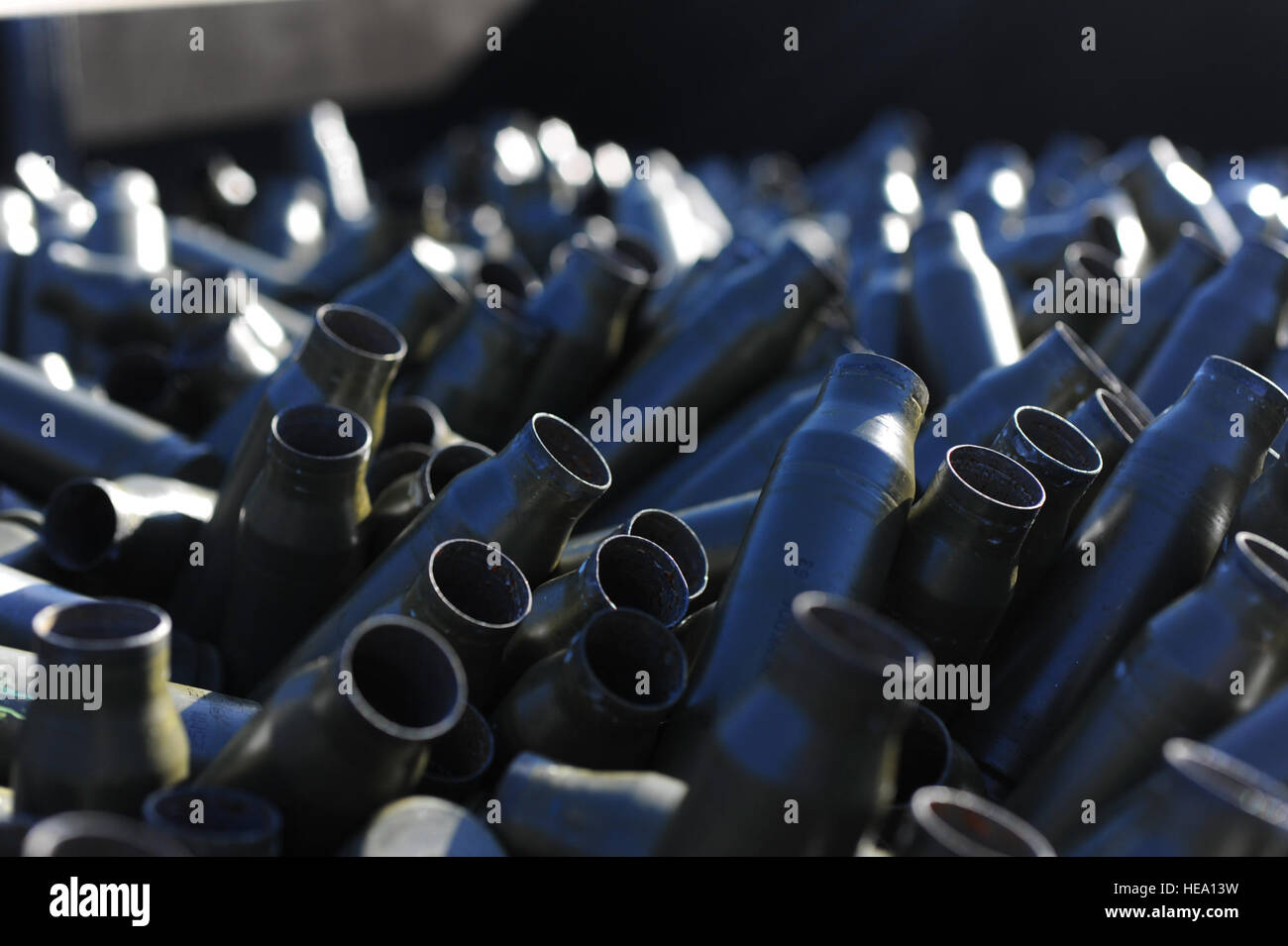 Spent 25mm shell casing sit in a bin at Hurlburt Field, Fla. Nov. 6, 2013. Shell casings brought to the facility are recycled into new ammunition. Staff Sgt. John Bainter) Stock Photo