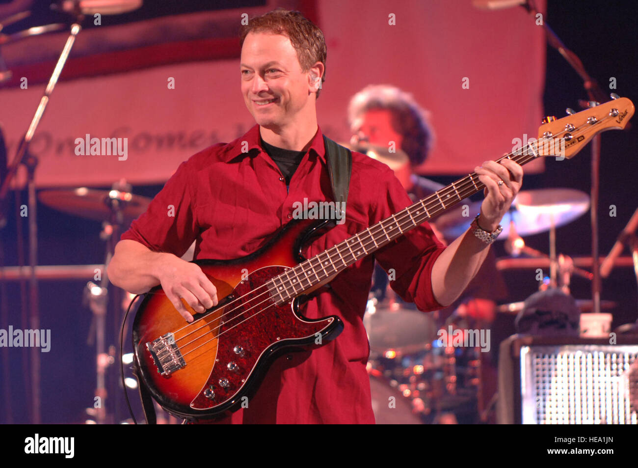 Gary Sinise, bass player of Lt. Dan Band, plays for the troops and their families during a USO show at Ramstein Air Base, Germany, May 14, 2007.  Since 2003 the band has been performing for charities and nonprofit organizations.   Airman 1st Class Amber Bressler) (Released) Stock Photo