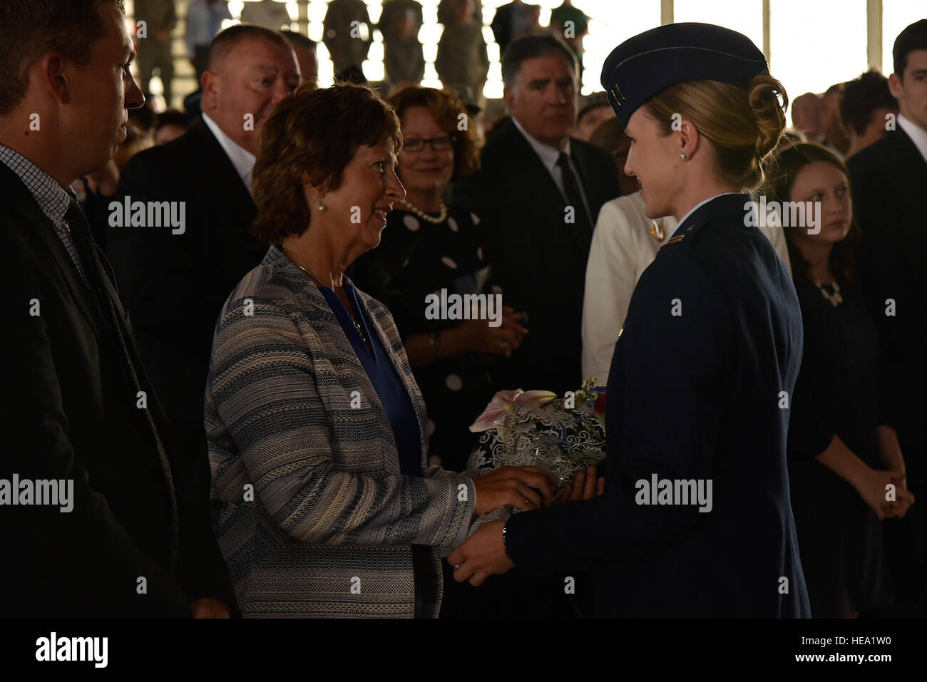 Mrs. Laura Hyten, wife of Gen. John Hyten, receives flowers as a thank