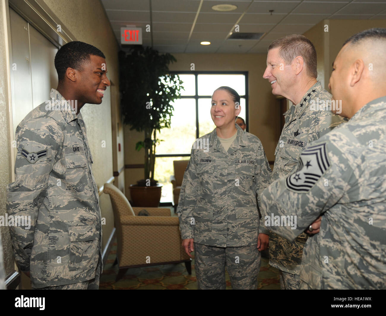 U.S. Air Force Chief Master Sgt. Paula Eischen, center, with the 81st Medical Group, introduces Airman 1st Class Cory Gage, left, with the 81st Diagnostic and Therapeutics Squadron, to Gen. Robin Rand, second from right, the commander of Air Education and Training Command (AETC), and Chief Master Sgt. Gerardo Tapia, the command chief of AETC, at the Bay Breeze Event Center at Keesler Air Force Base, Miss, Nov. 14, 2013.  Kemberly Groue Stock Photo