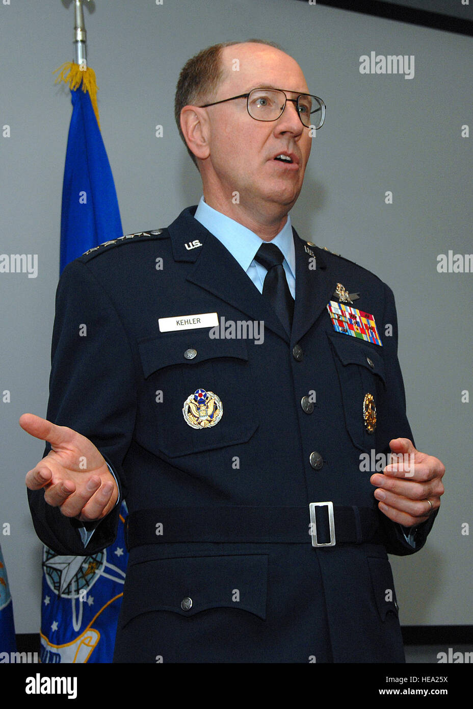 The Air Force Space Command Commander models a prototype of the proposed Air  Force service dress uniform during a formal ceremony, demonstrating design,  fit, and functionality for evaluation purposes Stock Photo -