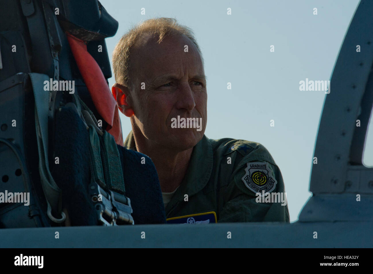 California Air National Guard Maj. Gen. Jon Kelk, both the ANG mobilization assistant to the U.S. Air Forces in Europe/Air Forces Africa commander and the commander, chief of staff of the CANG, looks inside the cockpit of an Massachusetts ANG F-15C Eagle fighter aircraft assigned to the 104th Fighter Wing, Barnes ANG Base, Mass., during the Romanian air force's 71st Air Base's air show and open house at Campia Turzii, Romania, July 23, 2016. The aviation demonstration took place during the middle of the U.S. Air Force's 194th Expeditionary Fighter Squadron's six-month long theater security pac Stock Photo
