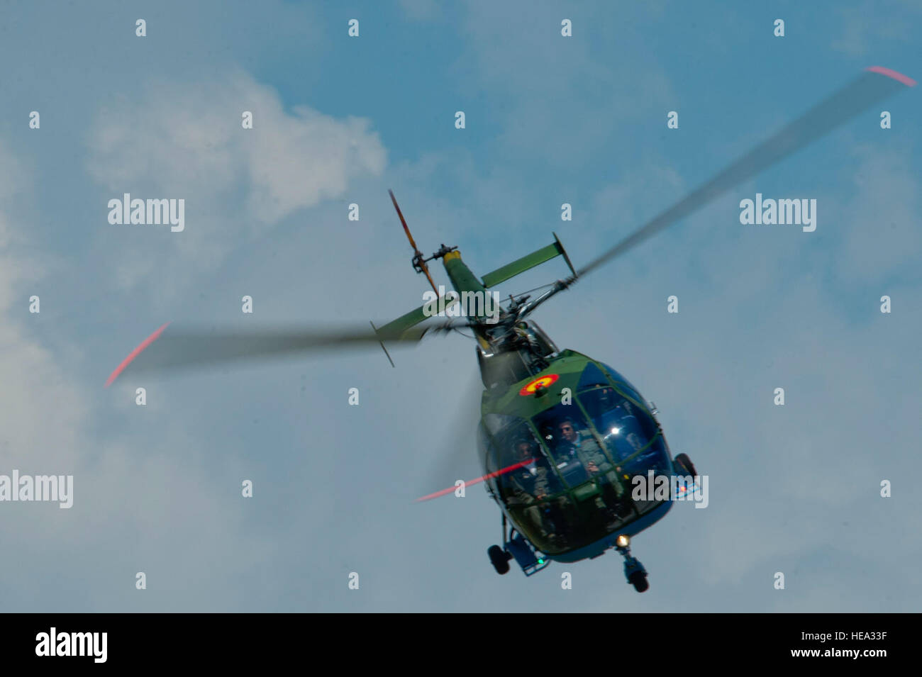 A Romanian air force Puma helicopter assigned to the 71st Air Base flies over the flightline during the base's air show and open house at Campia Turzii, Romania, July 23, 2016. The aviation demonstration took place during the middle of the U.S. Air Force's 194th Expeditionary Fighter Squadron's six-month long theater security package deployment to Europe in support of Operation Atlantic Resolve, which aims to bolster the U.S.'s continued commitment to the collective security of NATO and dedication to the enduring peace and stability in the region. The unit, comprised of more than 200 CANG Airm Stock Photo