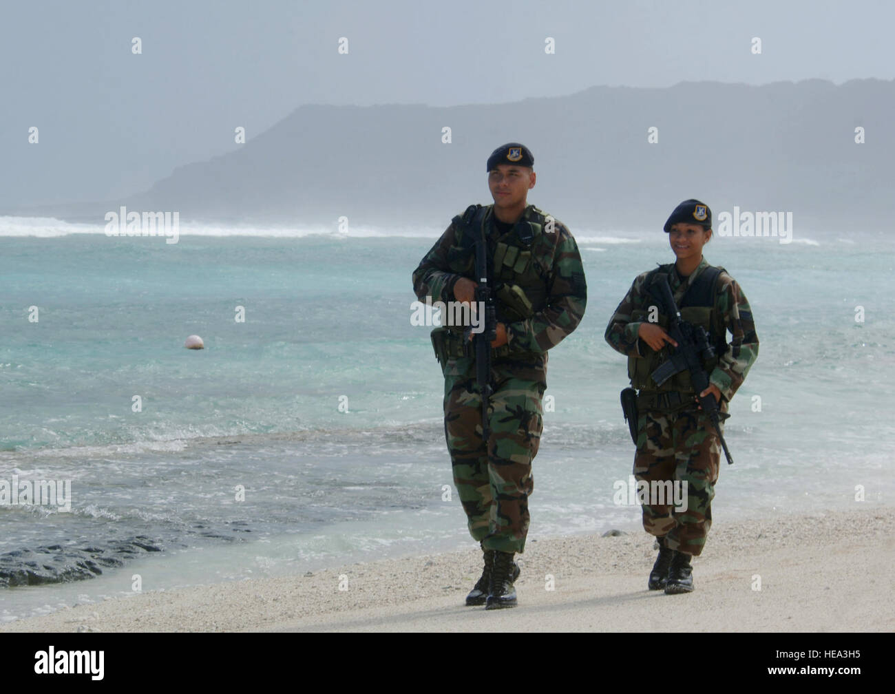 ANDERSEN AIR FORCE BASE, Guam (AFPN) -- Senior Airman Maria Ronquillo and  Staff Sgt. Michael Quitugua patrol Tarague Beach here. Both Airmen are  assigned to the Guam Air National Guard's 254th Security