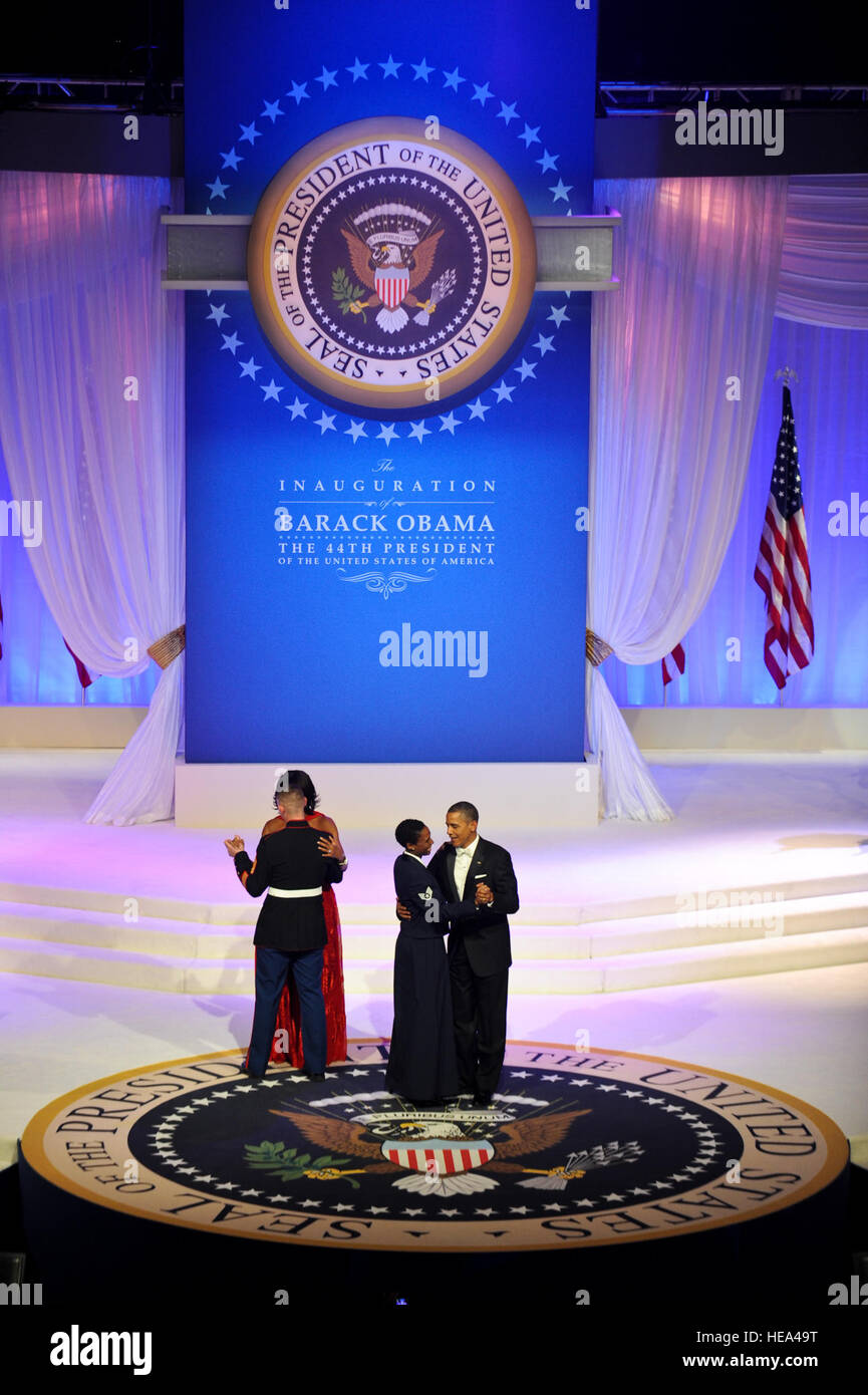 President Barack Obama and his wife Michelle Obama dance with Staff Sgt. Bria Nelson, 579th Medical Operations Squadron, Joint Base Anacostia-Bolling, Washington, D.C., and Gunnery Sgt. Timothy Easterling, Marine Barracks, Washington, D.C., during the 2013 Commander In Chief inaugural ball at the Walter E. Washington Convention Center in Washington D.C., Jan. 21, 2013.  Throughout the 57th Presidential Inauguration, the Obama and Biden families have taken the opportunity to highlight the spirit of service and selflessness seen everyday U.S. military men, women and their families.  Chief Master Stock Photo