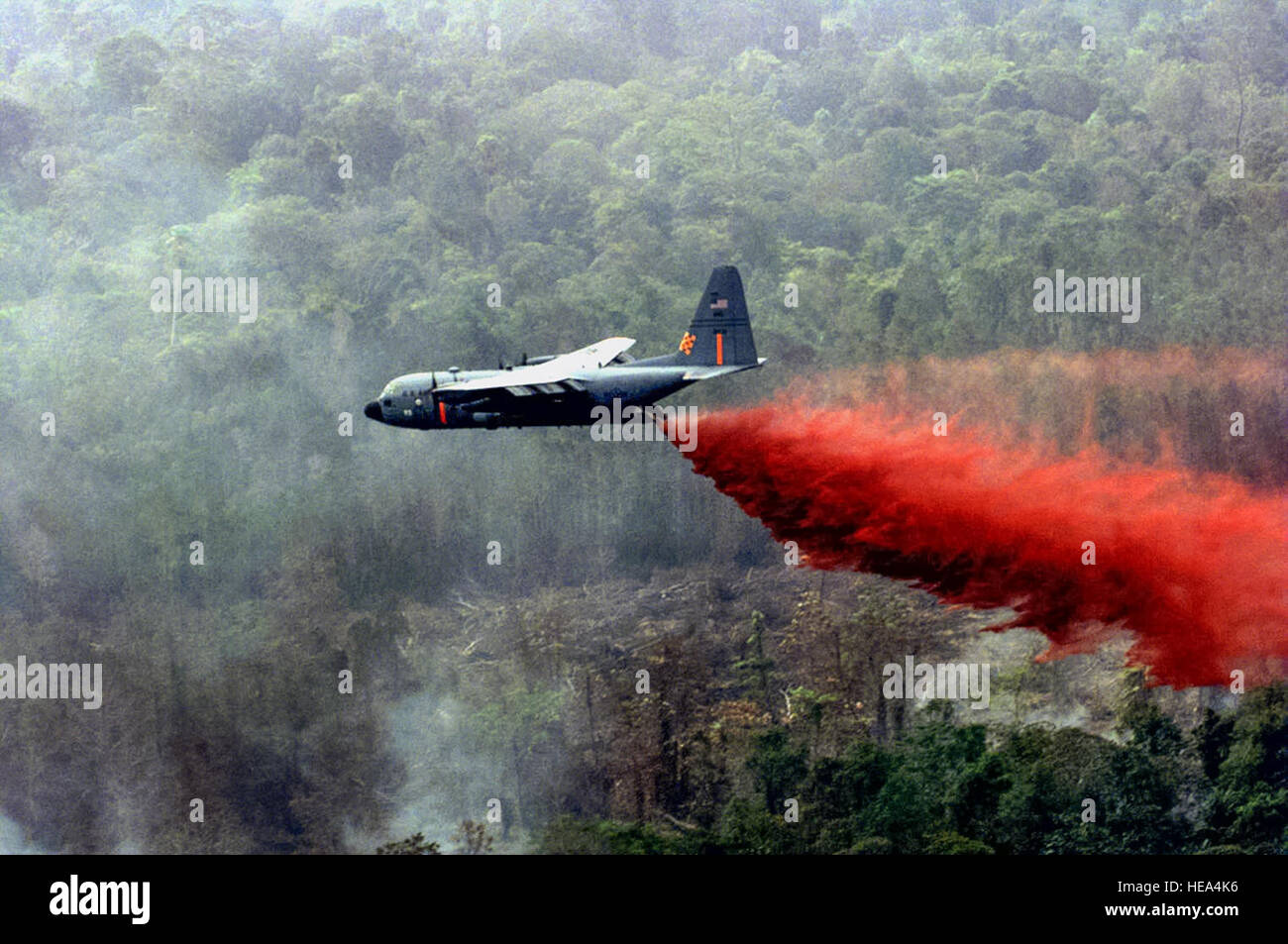 Air Force Reserve aircrews and maintainers stand ready to fight wildfires using C-130 Hercules equipped with modular airborne firefighting systems, similar to this one.  The aircraft can drop up to 3000 gallons of retardant covering an area one-quarter of a mile long and 60 feet wide. (File photo) Stock Photo