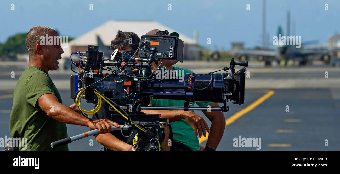 Camera crew members for the television series 'Hawaii Five-0' prepare to film a scene on the flight line at Joint Base Pearl Harbor-Hickam, Hawaii, Oct. 9, 2013.  Tech. Sgt. Jerome S. Tayborn Stock Photo