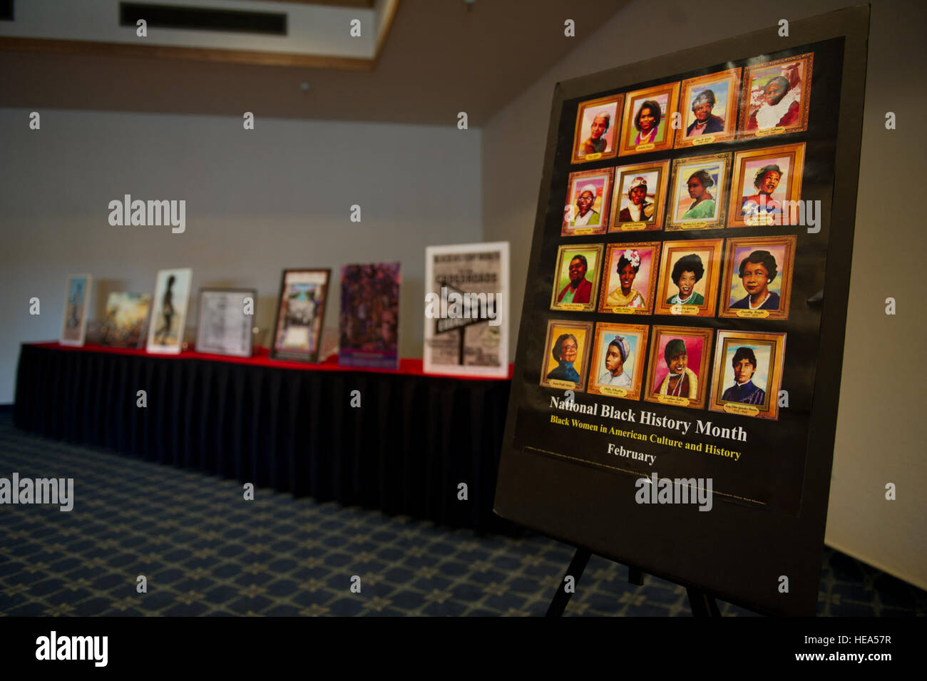 A poster of African-American women stands on display with other posters ...