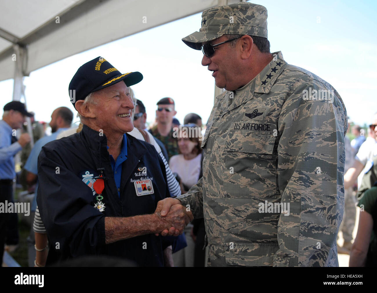 U.S. Air Force Gen. Philip M. Breedlove, Commander, U.S. European Command and NATO Supreme Allied Commander Europe, visits with World War II veterans at a paratrooper drop at Iron Mike memorial here, June 8, 2014. More than 600 U.S., German, Dutch and French service members jumped to honor the paratroopers that jumped into Normandy on D-Day. The event was one of several commemorations of the 70th Anniversary of D-Day operations conducted by Allied forces during World War II June 5-6, 1944. Over 650 U.S. military personnel have joined troops from several NATO nations to participate in ceremonie Stock Photo