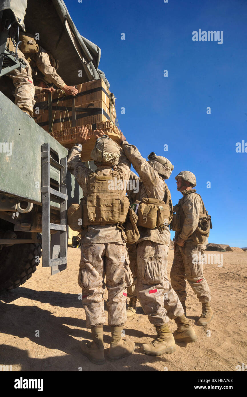 U.S. Marines assigned to Combat Logistics Battalion, Headquarters Regiment, Camp Pendleton, Calif., load Meals, Ready-to-Eat (MRE) into a military truck for transport during Integrated Training Exercise 2-15 at Marine Corps Air Ground Combat Center Twentynine Palms (MCAGCC), Calif., Feb. 11, 2015. MCAGCC conducts relevant live-fire combined arms training, urban operations, and joint/coalition level integration training that promotes operational forces' readiness.  Tech. Sgt. Joselito Aribuabo Stock Photo
