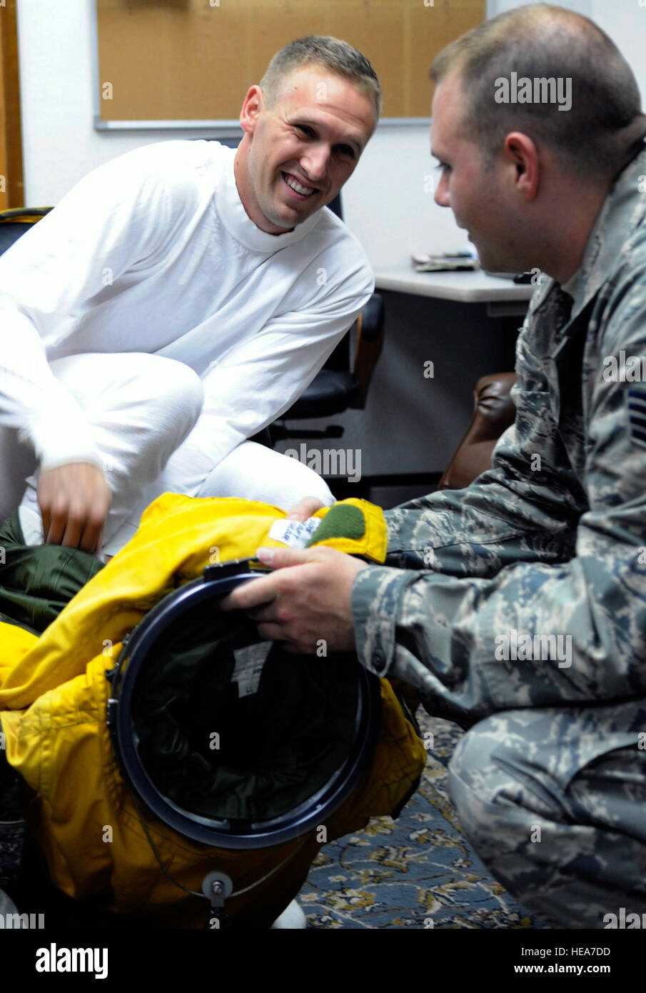 SOUTHWEST ASIA – Staff Sgt. Mark Reith helps Capt. Peter J. Gryn don his specialized suit before a flight Oct. 4, 2009. The sortie was Captain Gryn’s first combat mission. Both Airmen are deployed from Beale Air Force Base, Calif. (Air Force photo/Staff Sgt. J.G. Buzanowski) Stock Photo