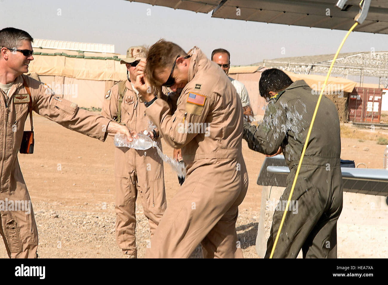 Lt. Col. Todd Daggett (left), 52nd Expeditionary Flying Training Squadron deputy of operations, along with other Airmen from the 52nd EFTS and Iraqi air force Flying Training Wing, congratulate the crew of a Cessna 172 July 13 at Kirkuk Regional Air Base, Iraq, after their historic training sortie that surpassed 2,000 flight training hours. Airman First Class Randi Flaugh) Stock Photo