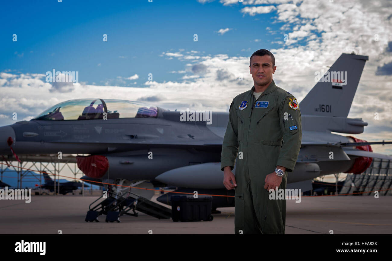 Iraqi Air Force Capt. Hama, student pilot, and an IAF F-16 Fighting Falcon. Hama delivered one of the IAF's two new F-16Ds to their training location at Tucson International Airport, Dec. 16, 2014. Senior Airman Jordan Castelan) Stock Photo