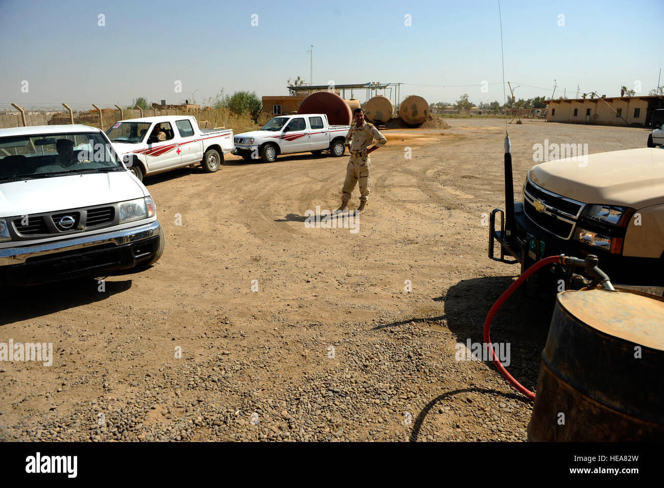 Iraqi soldiers wait in line to refuel their vehicles at Camp Taji, near Baghdad, Iraq, July 11. The Iraqi fuels depot is run exclusively by the Iraqi army with some assistance from an American Airman assigned to the Logistics Military Advisor Team. Stock Photo