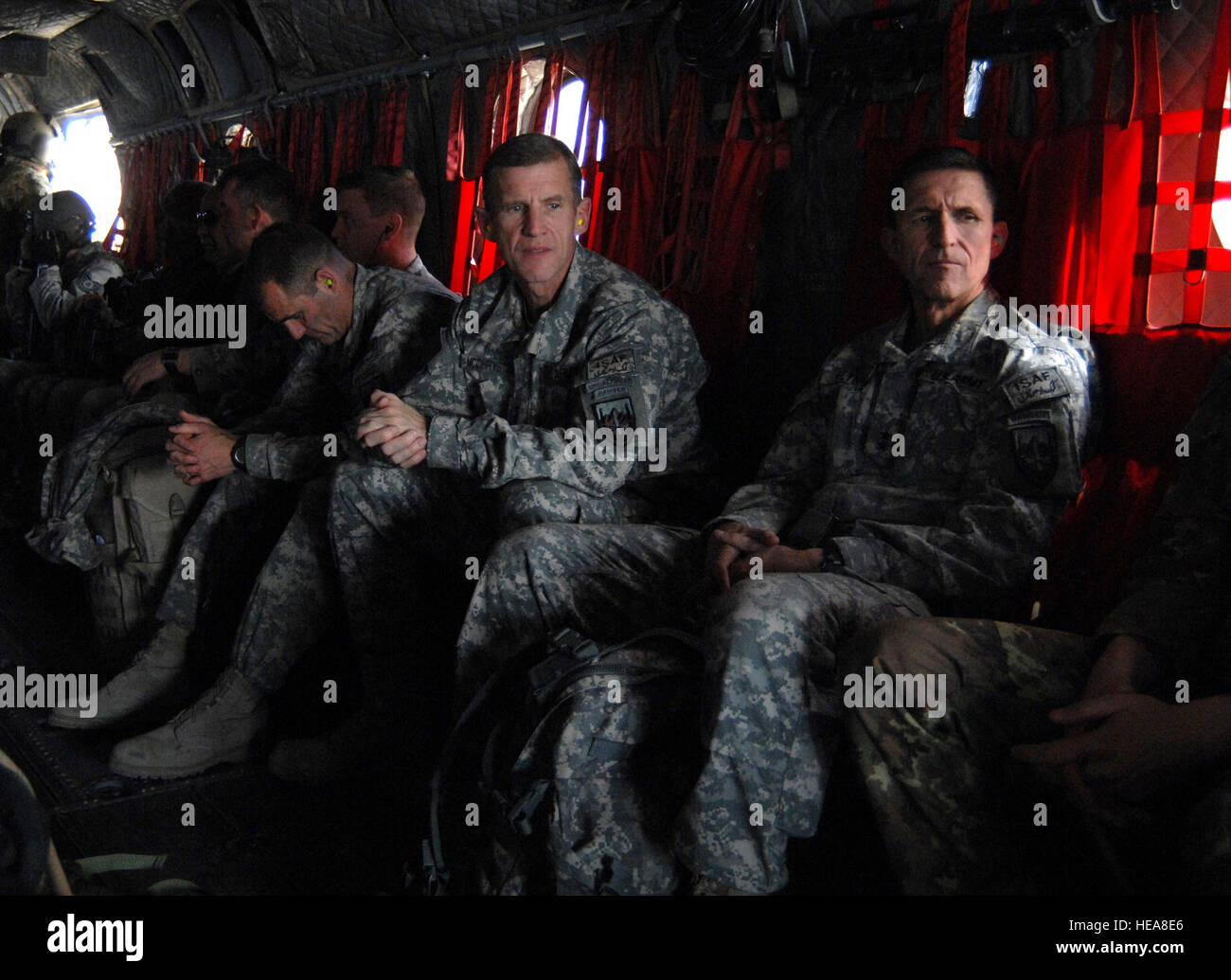 Flying over Farah City onboard an Italian CH-47C Chinook helicopter, Gen. Stanley McChrystal, the International Security Assistance Force (ISAF) Commander, admires the view while sitting next to Maj. Gen. Michael Flynn, the senior intelligence officer in Afghanistan, Jan. 22, 2009.  During his visit to Forward Operating Base Farah, Afghanistan, Gen. McChrystal not only met with coalition leadership and ISAF service members, but also with Provincial Governor Rahool Amin in order to discuss recent kinetic and reconstruction operations across the province. Stock Photo