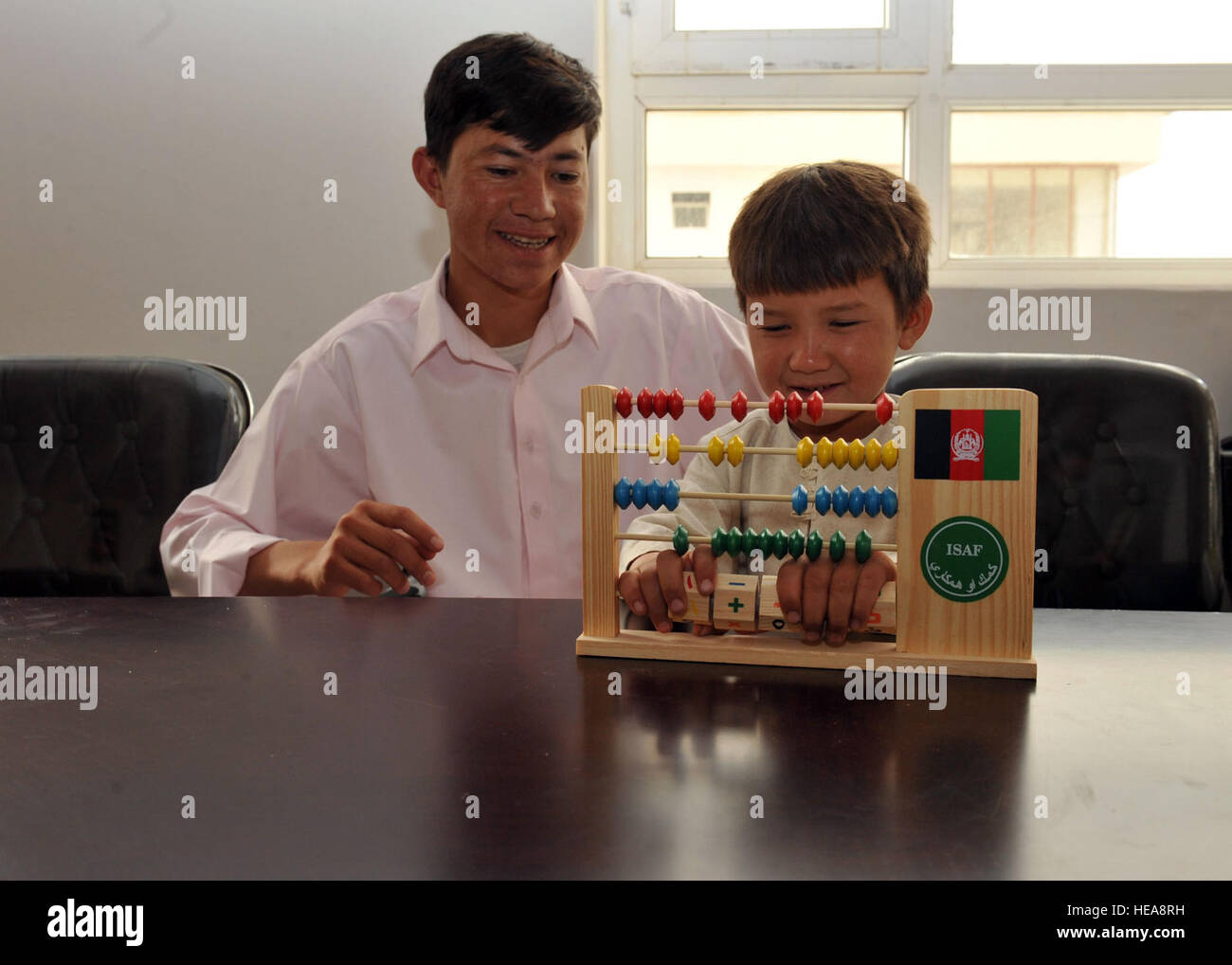 Afghan children use an abacus provided by the Ghazni Provincial ...