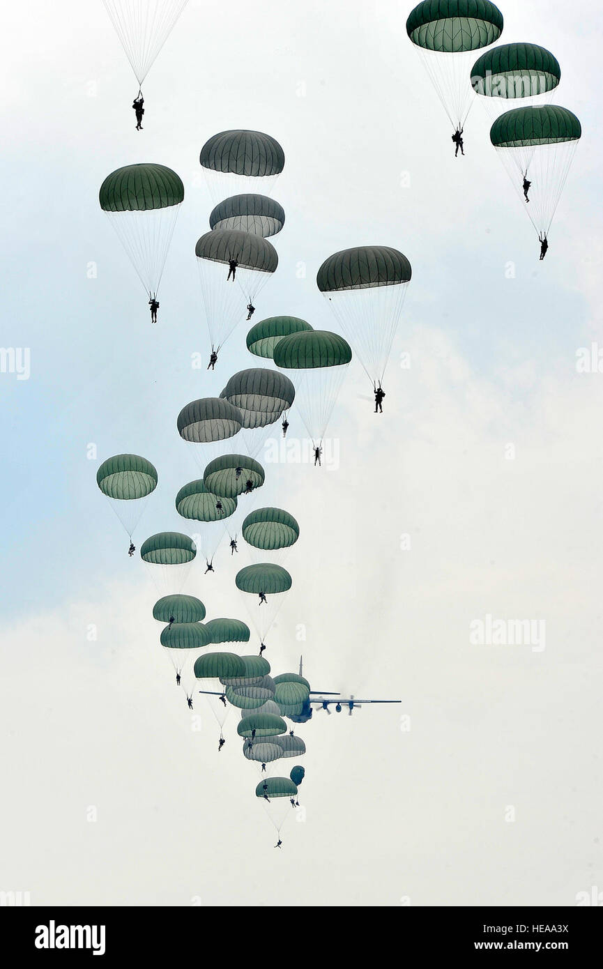 U.S. Air Force C-130 Hercules drops U.S. Army paratroopers of the 82nd Airborne Division onto Luzon drop zone during a training mission prior to Joint Operations Access Exercise 12-02 at Mackall Army Airfield, N.C., June 4, 2012. JOAX is a two-week forcible entry and ground combat exercise to prepare Air Force and Army service members to respond to worldwide crises and contingencies. Stock Photo