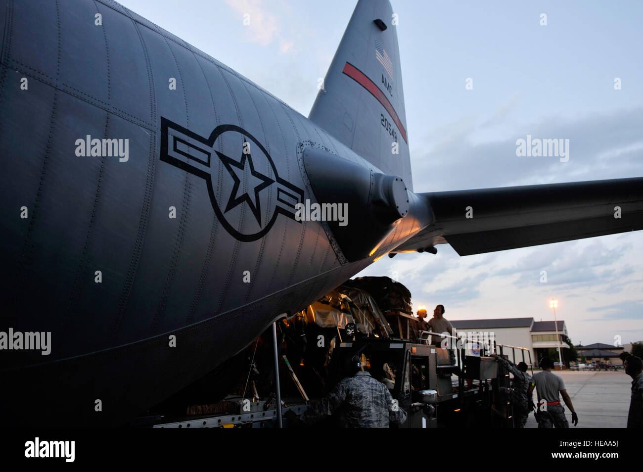 A U.S. Air Force C-130H Hercules aircrew from the 30th Airlift Squadron and Airmen from the 3rd Aerial Port Squadron load heavy equipment onto the aircraft before a mission in support of Joint Operations Access Exercise on Fort Bragg, N.C., June 7, 2012.  A joint operations access exercise is a two-week exercise to prepare Air Force and Army service members to respond to worldwide crises and contingencies.   Staff Sgt. Eric Harris Stock Photo