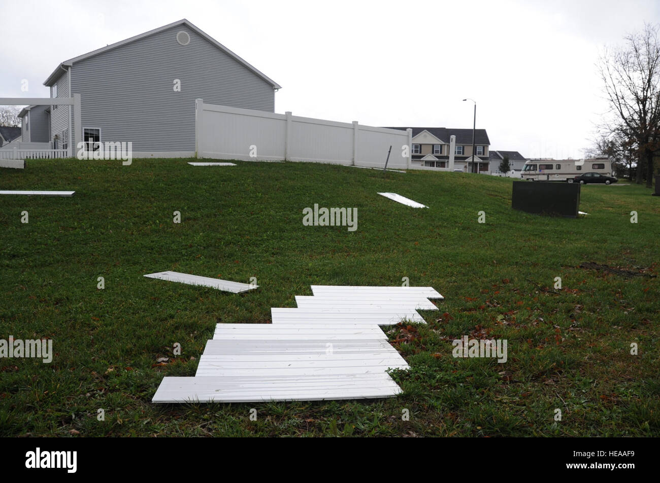 Plastic fence panels are scattered in the Falcon Courts East housing
