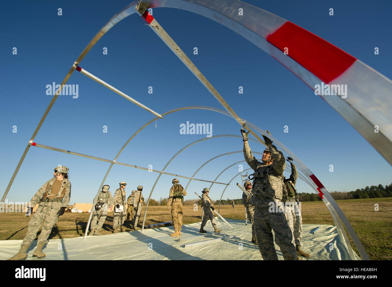 U.S. Air Force Airmen set up an Alaskan tent during a field exercise at