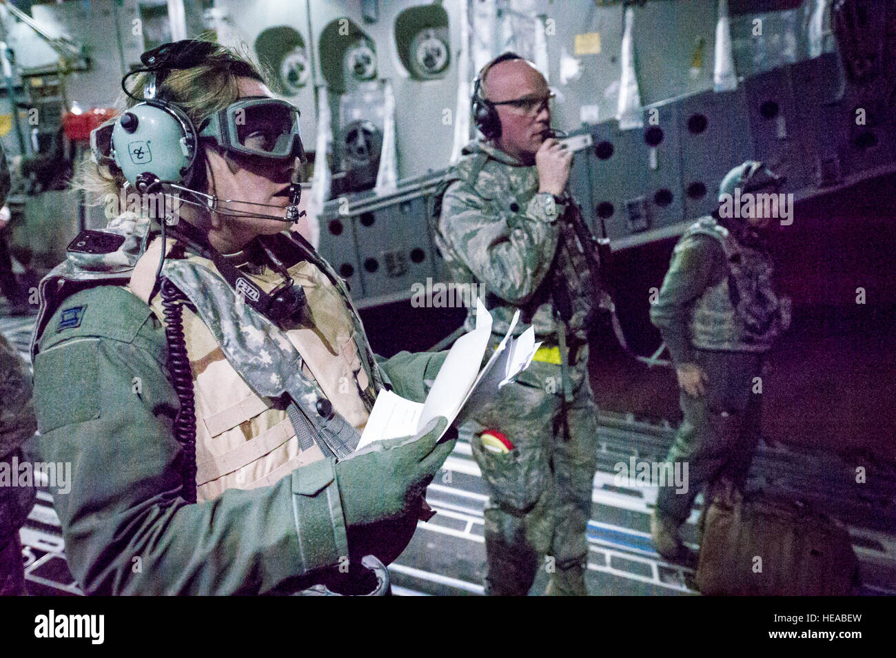 U.S. Air Force aeromedical crew members wait on the ramp of a C-17 Globemaster III for the arrival of patients at landing zone Geronimo at Joint Readiness Training Center (JRTC), Fort Polk, La., Jan. 18, 2014. Service members at JRTC 14-03 are educated in combat patient care and aeromedical evacuation in a simulated combat environment.  Master Sgt. John R. Nimmo Sr./) Stock Photo