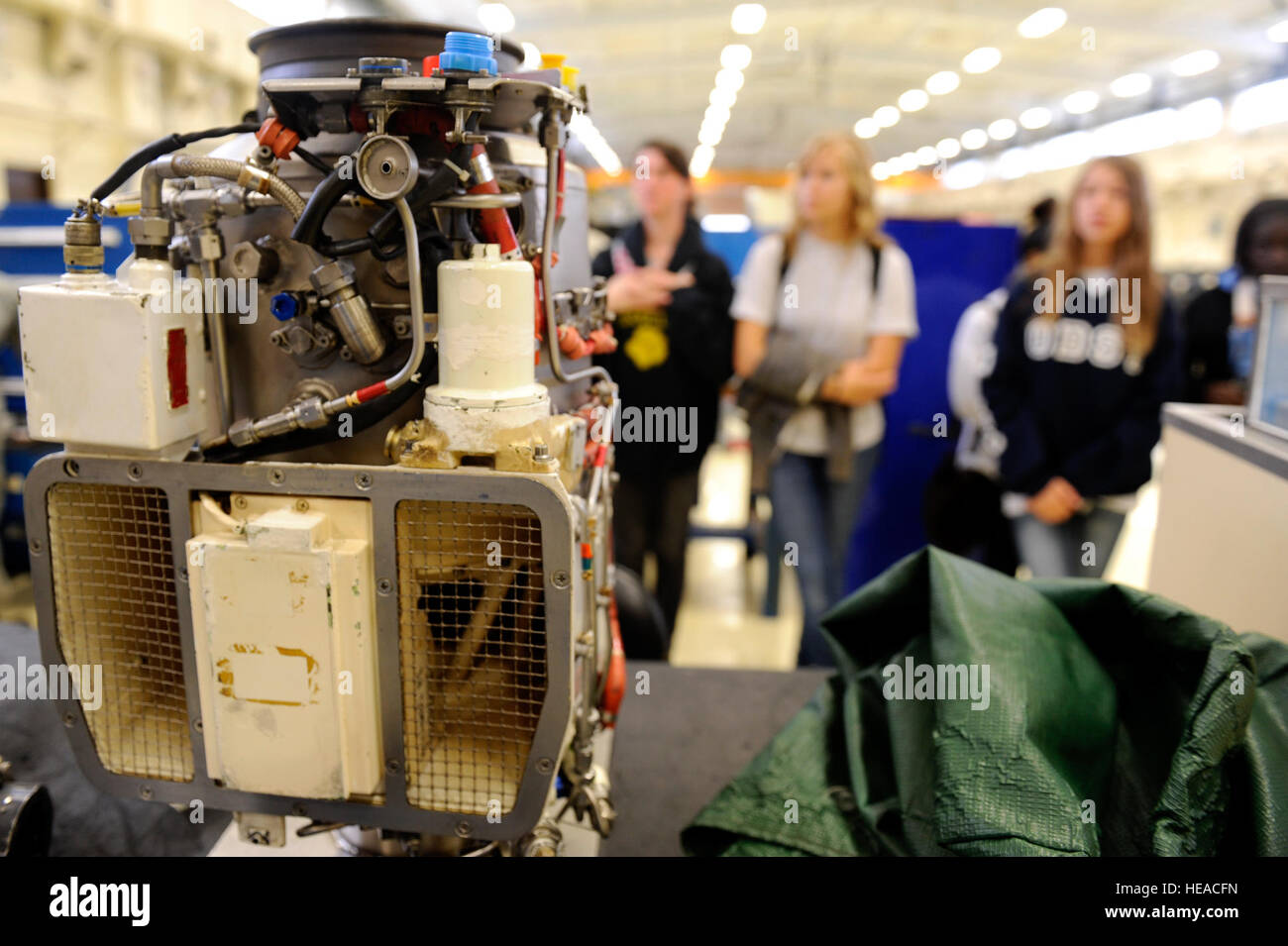 Kadena High School Air Force Junior Reserve Officer Training Course students look at a jet fuel starter for an F-15 Eagle engine start system during a tour of the 18th Component Maintenance Squadron Propulsion Flight on Kadena Air Base, Japan, Nov. 14, 2013. During the tour of the 18th CMS propulsion shop, Kadena HS JROTC students, who aspire to be future engineers, were taught about different components and functions of F-15 Eagle and A-10 Thunderbolt II aircraft engines.  Senior Airman Maeson L. Elleman) Stock Photo