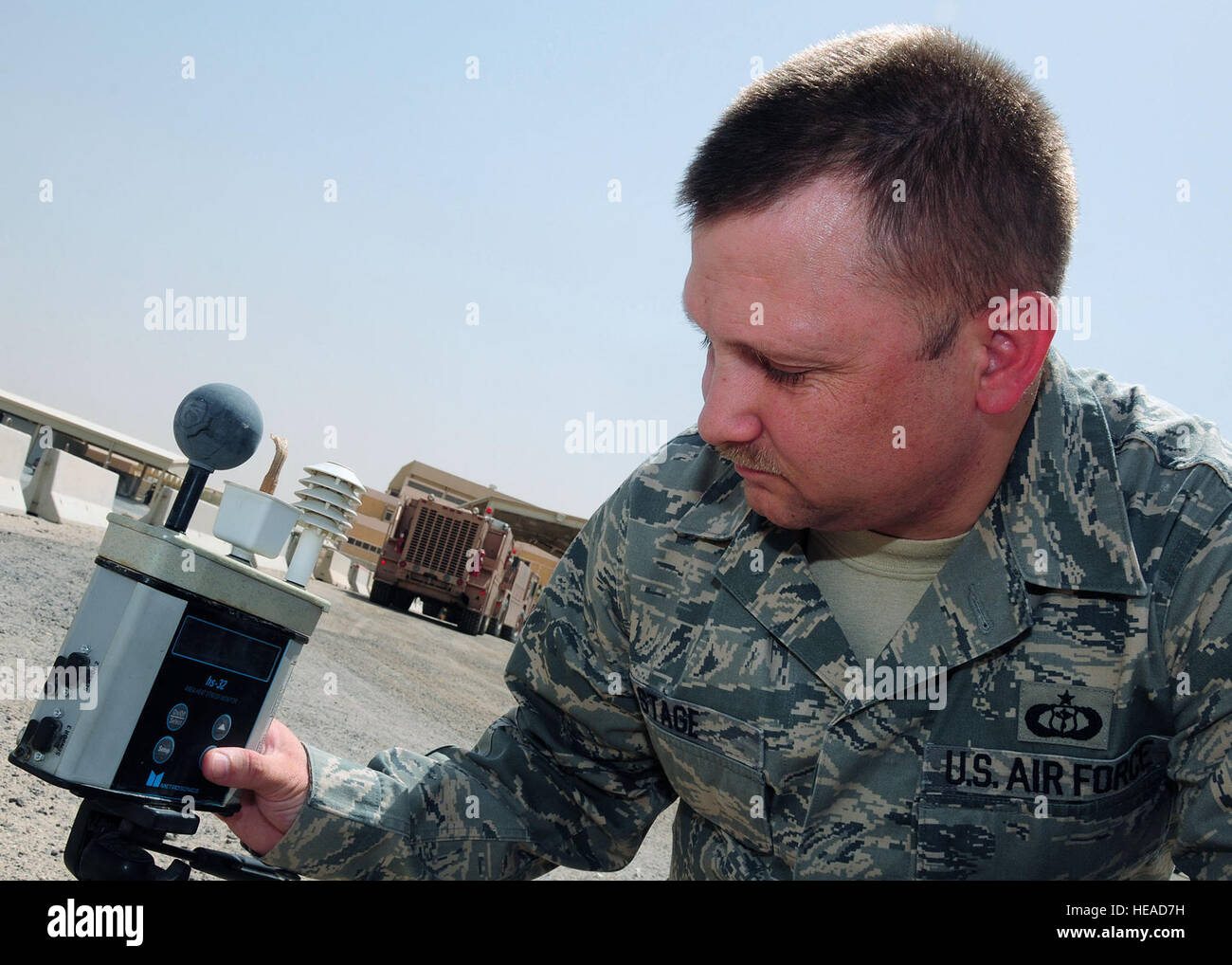 SOUTHWEST ASIA -- Tech. Sgt. Richard Stage, 386th Expeditionary Operations Support Squadron weather forecaster, checks the wet bulb globe temperature reading on a hs-32 area heat stress monitor at an undisclosed location in Southwest Asia Sept. 15, 2009.  Sergeant Stage is deployed from the 62nd Airlift Wing, McChord Air Force Base, Wash., and hails from Elmira, N.Y.  Tech. Sgt. Tony Tolley) Stock Photo