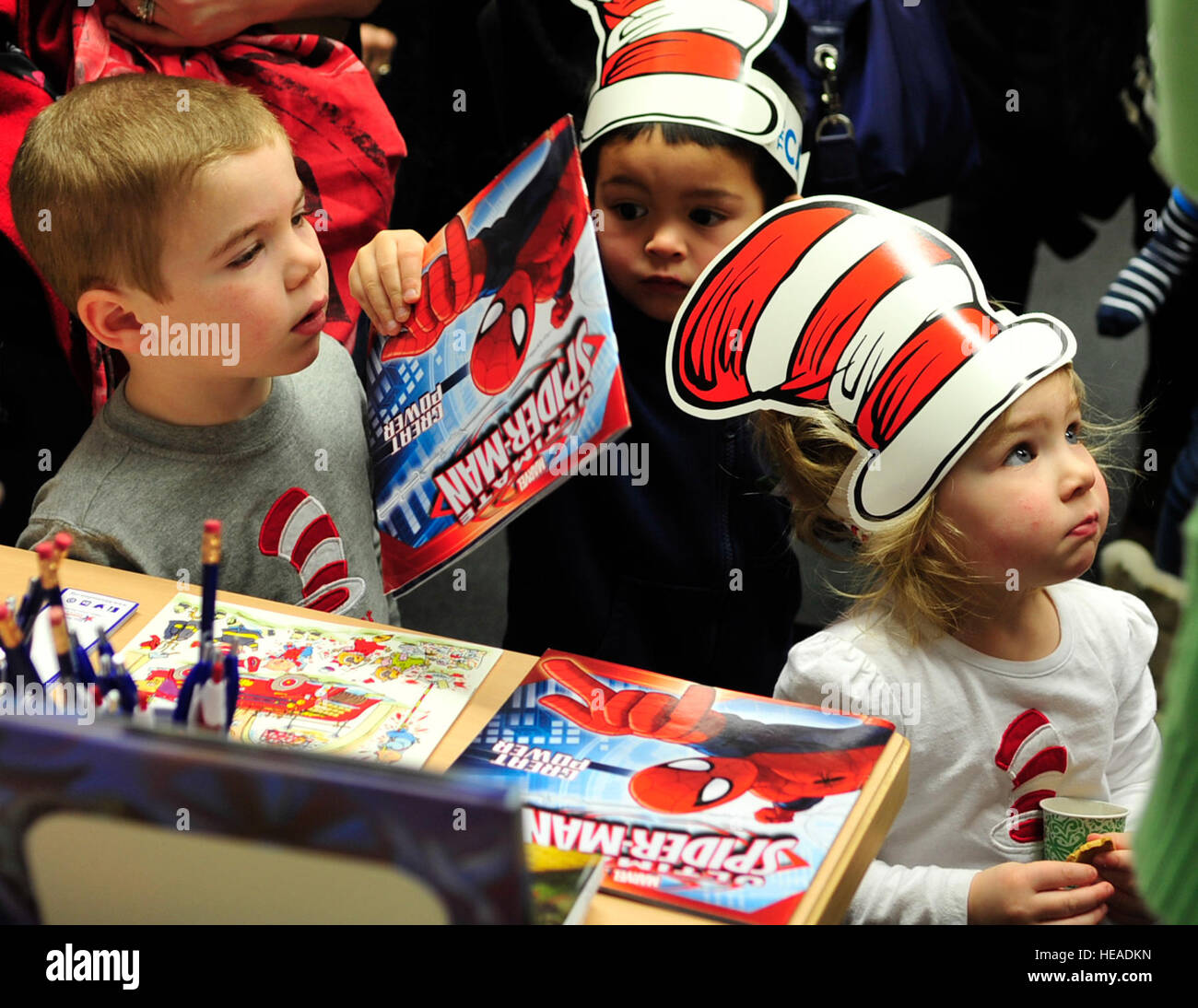 Children receive free books during Read Across America, March 5, 2015, at Ramstein Air Base, Germany. The event consisted of story-time, snacks and free books for the children. Airman 1st Class Larissa Greatwood) Stock Photo