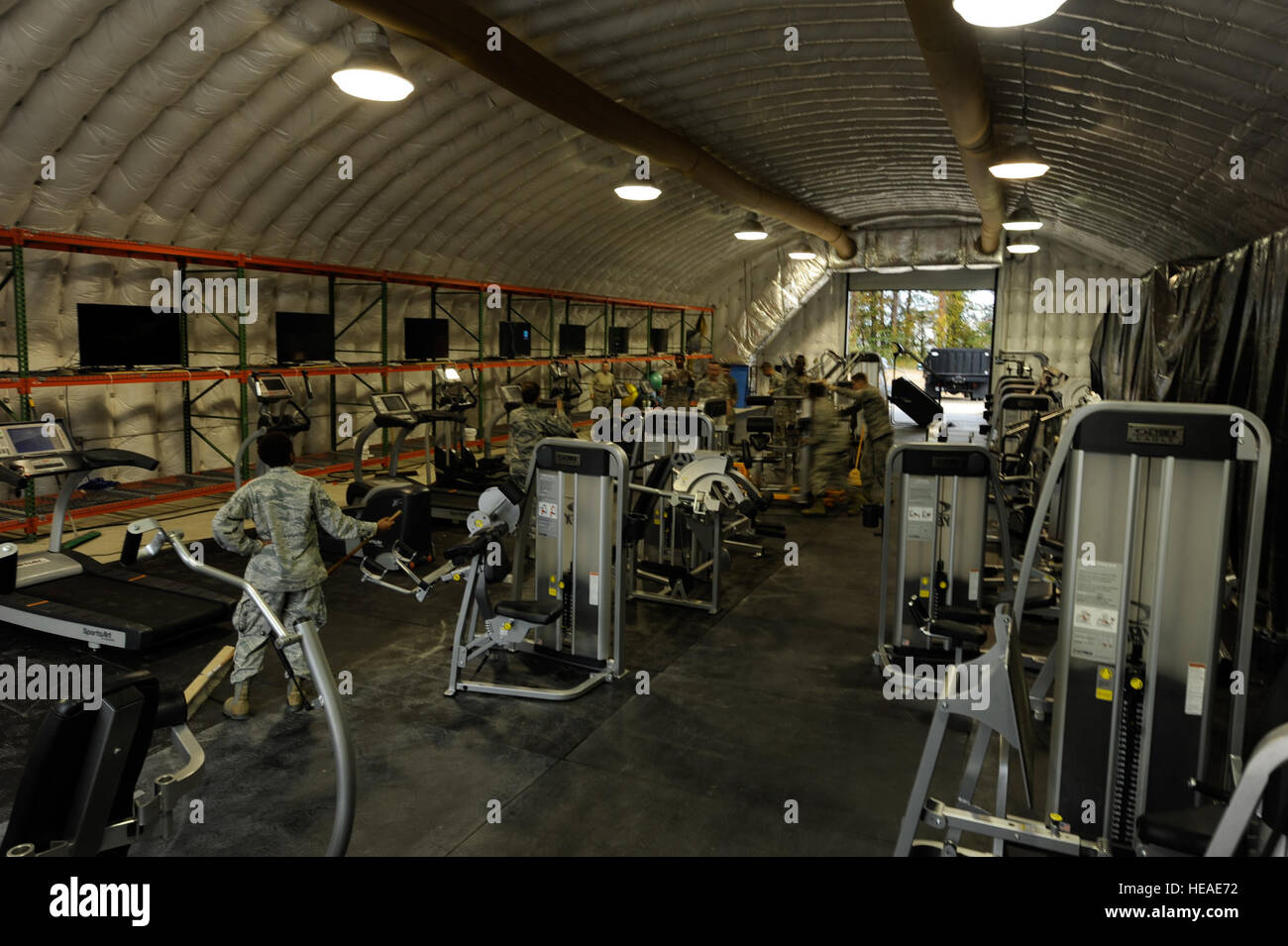 Airmen assigned to the 633rd Force Support Squadron set up gym