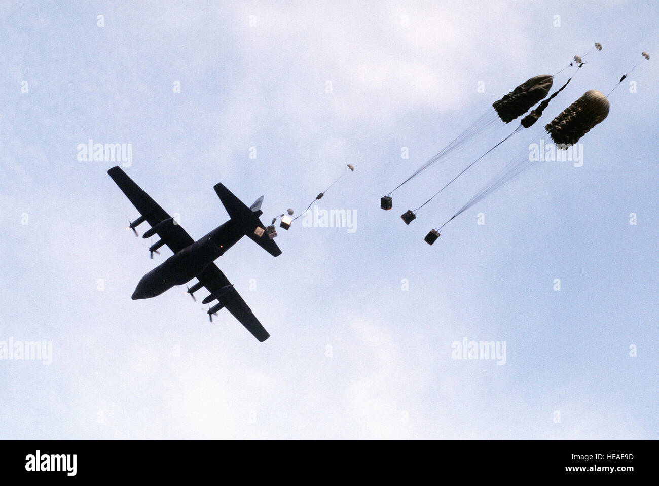 A C 130 Hercules Aircraft Drops Supplies By Parachute To Troops