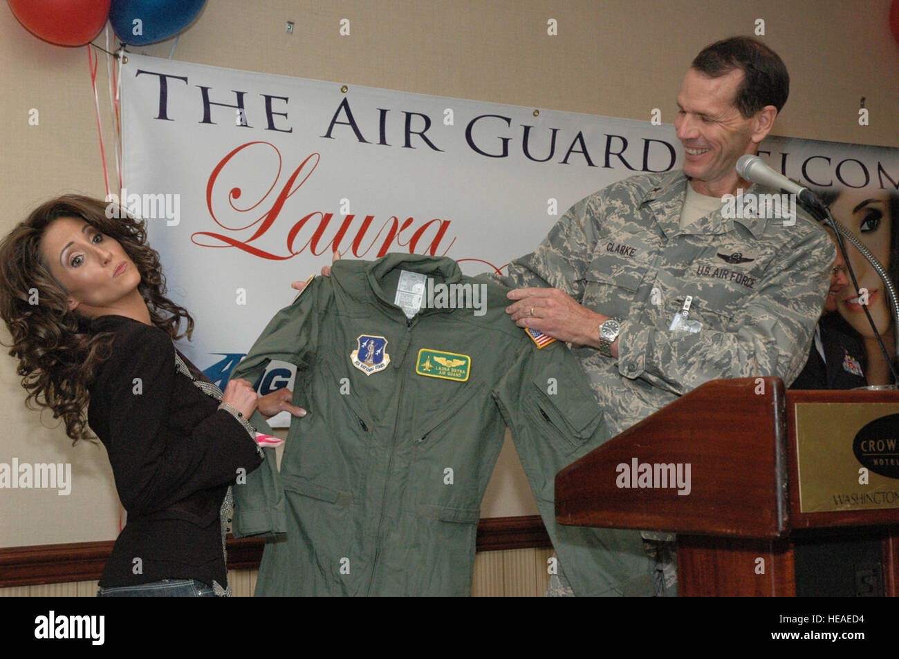 Brigadier General Stanley 'Sid' Clarke, the Deputy Director of the Air National Guard presents a flight suit to rising country music star Laura Bryna on May 30th, 2008 at an unveiling event of her song 'Hometown Heroes' at the Crowne Plaza Hotel in Arlington, Virginia.  Laura Bryna is the new voice of the Air Guard advertising campaign. Stock Photo